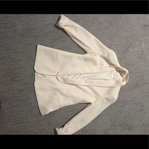 Cream colored blazer mural art has no boundaries